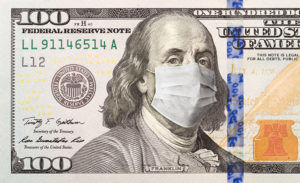 $100 dollar bill with coronavirus mask over Ben Franklin's face